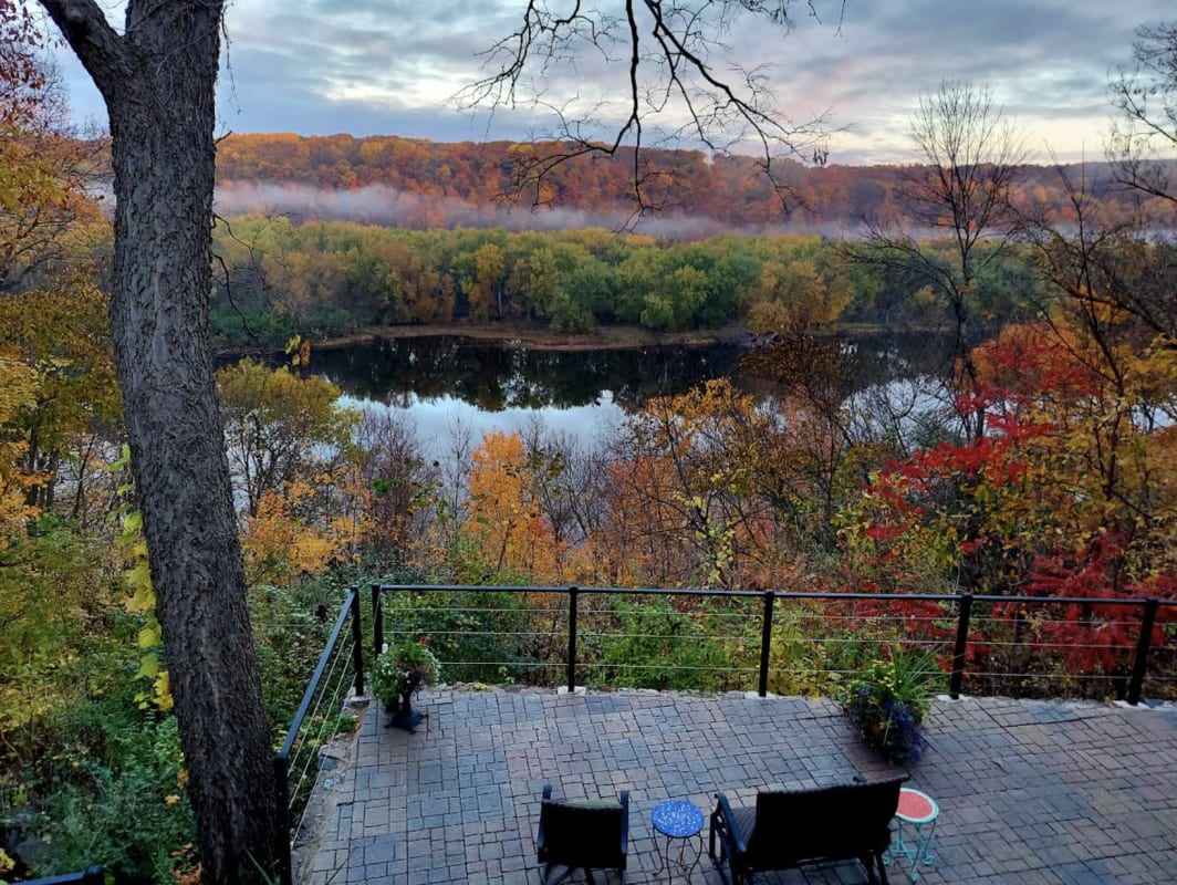 Stunning autumn river views from this property showcase vibrant fall foliage and serene waters framed by rolling hills.
