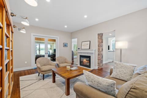 A stylish living room featuring a fireplace and comfortable seating.