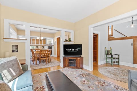 Cozy living room with a dining area in a well-lit space.