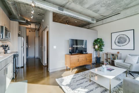 Interior view of a modern apartment with living room and kitchen.