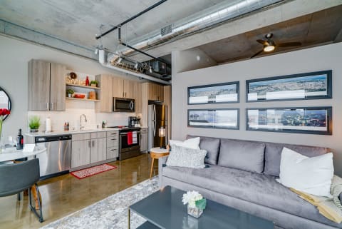 Stylish urban apartment interior with kitchen and living area.