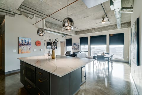 Interior view of a modern apartment with an open kitchen and living space.