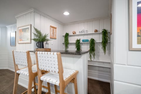 Stylish kitchen nook featuring bar stools and decorative elements.