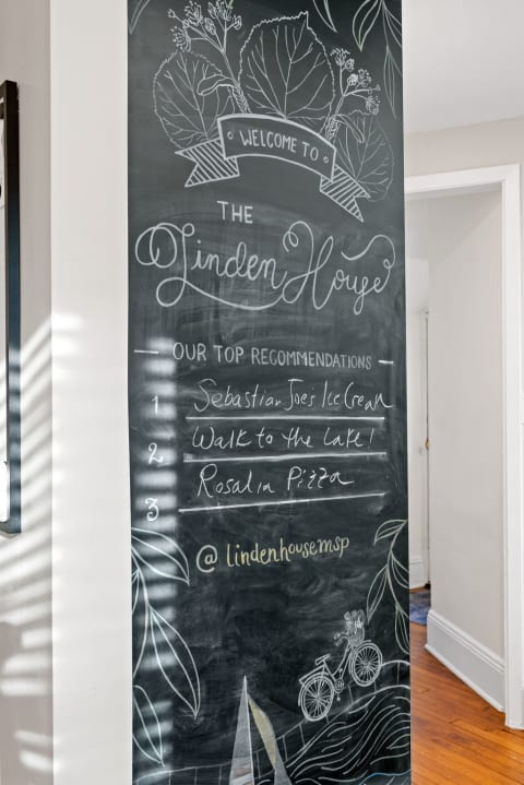 Chalkboard with welcome message and top recommendations for local spots.