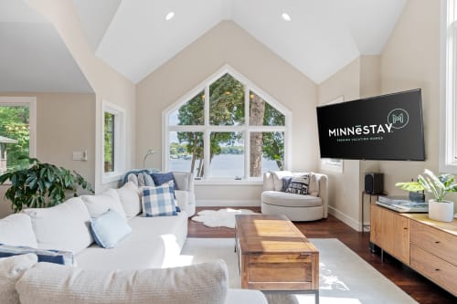 Bright and inviting living room with lake view.