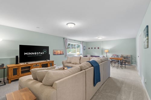 Settle into your spacious living area with plush sectional seating, perfect for movie nights and family gatherings in comfort.