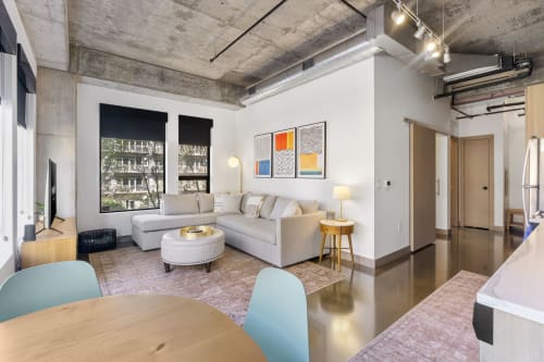 A contemporary living space with a blend of industrial and modern design elements.