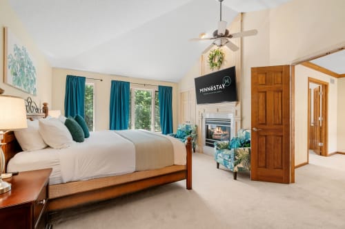 A stylish and cozy bedroom featuring modern decor and vibrant accents.